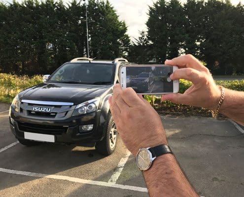 taking a picture of a vehicle